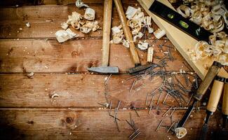 Working tool. Chisel, hammer and nails. photo