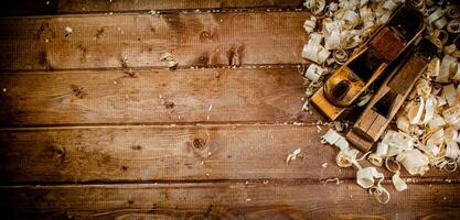 Working tool. Planer with wooden shavings. photo