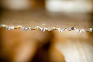 Hand saw blade on a wooden background. photo