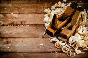 Working tool. Planer with wooden shavings. photo