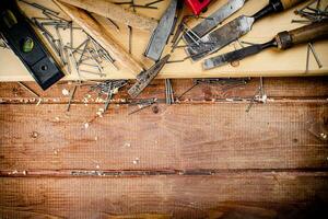 Working tool. Chisel, hammer and nails. photo