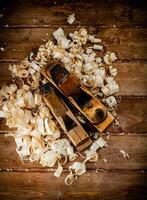 Working tool. Planer with wooden shavings. photo