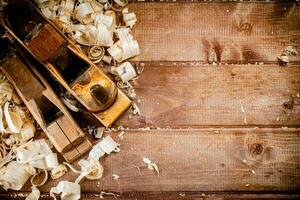 Working tool. Planer with wooden shavings. photo