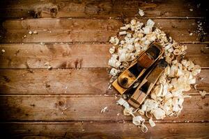 Working tool. Planer with wooden shavings. photo