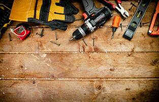 Working tool. Screwdriver with self-tapping screws on the table. photo