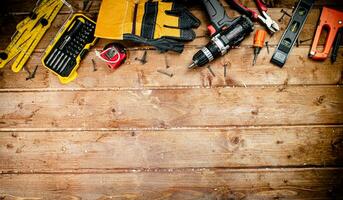 Working tool. Screwdriver with self-tapping screws on the table. photo