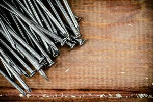 A pile of nails on the table. photo