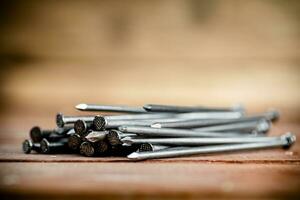 A pile of nails on the table. photo