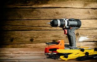 Working tool. Screwdriver with self-tapping screws on the table. photo