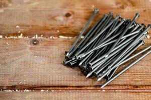 A pile of nails on the table. photo