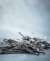 A bunch of nails on the table. photo