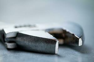 Metal wrench on the table. photo