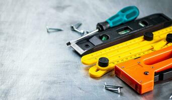 Construction stapler on the table. photo