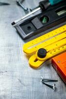 Construction stapler on the table. photo