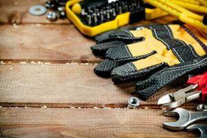 Wrenches with nuts on the table. photo