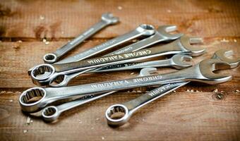 Wrenches with nuts on the table. photo