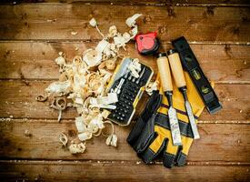 Chisels with wooden sawdust on the table. photo