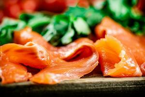 Pieces of salted salmon with parsley. photo