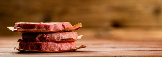 Fresh raw burger on the table. photo