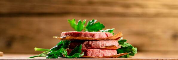 Fresh raw burger on the table. photo