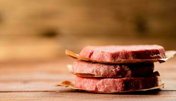 Fresh raw burger on the table. photo