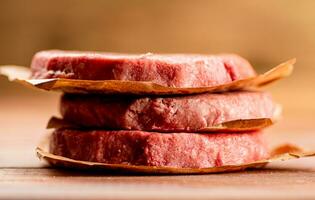 Fresh raw burger on the table. photo