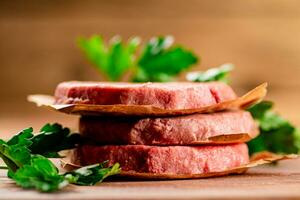 Fresh raw burger on the table. photo