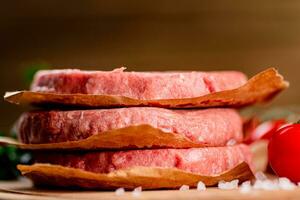 Fresh raw burger on the table. photo