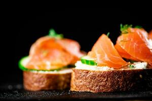 Salmon sandwich on the table. photo