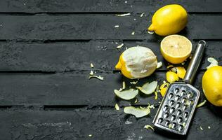 Fresh lemon zest with grater. photo