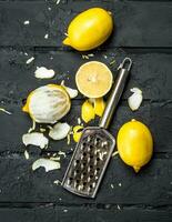 Fresh lemon zest with grater. photo