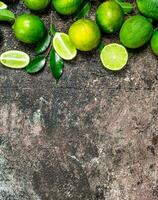 Pieces of ripe lime and a whole fresh lime. photo