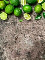 Pieces of ripe lime and a whole fresh lime. photo