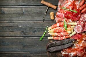 Antipasto background.A variety of meat snacks. photo