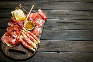 Antipasto background.A variety of meat snacks. photo