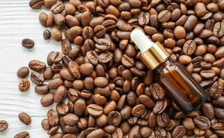 Skincare caffeine eye serum. Product bottle and coffee beans. photo