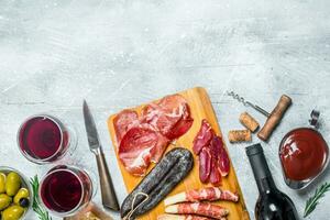 Antipasto background.Various Italian meat snacks. photo