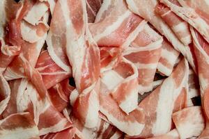 Raw bacon texture. photo