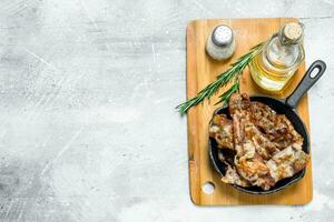 Fried bacon with spices. photo