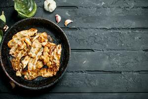 Fried bacon with spices. photo