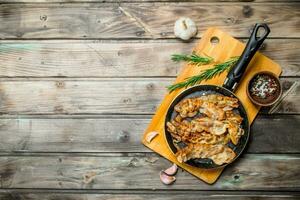 Fried bacon with garlic and spices. photo