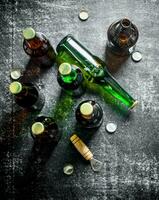 Beer bottles and a opener. photo