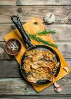 Fried bacon with garlic and spices. photo