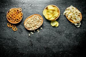 Varieties of snacks in the bowls. photo