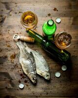 Beer and dried fish. photo