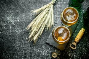 Beer in glasses and spikelets. photo