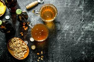 Beer and snacks in the bowls. photo