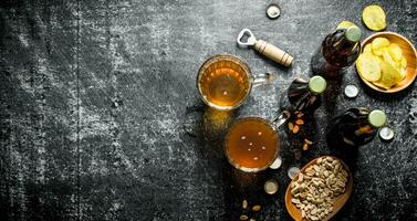 Beer and snacks in the bowls. photo