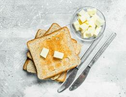 Breakfast. Toasted bread and butter. photo