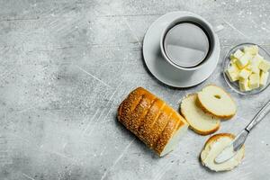 Breakfast. Bread with butter and hot coffee. photo